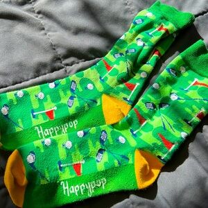 Golf happy pop socks. Slight pulling. Worn a cpl times.